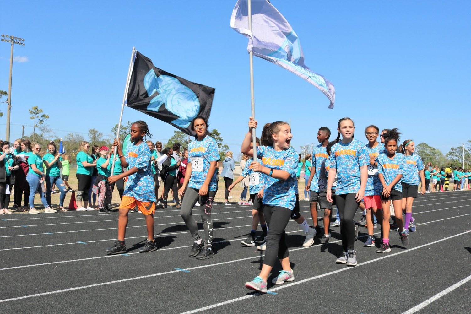Mason Elementary students march together in the 2018 Character Cup Parade of Champions.